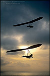 Photo: Pair of Hang gliders at sunset over the Pacific Ocean, from Fort Funston, San Francisco, California