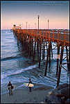Picture: Surfers watch the waves on a calm morning at wooden Oceanside Pier, San Diego County, California
