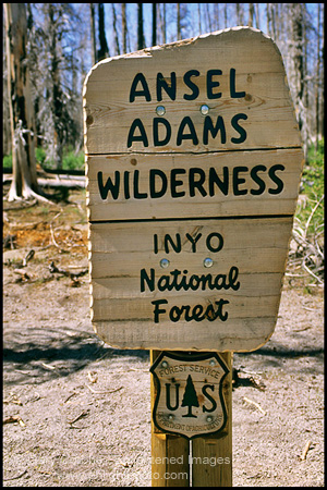 Photo: Sign marking the border at a trail entrance to the Ansel Adams Wilderness, near Devils Postpile, Eastern Sierra, California