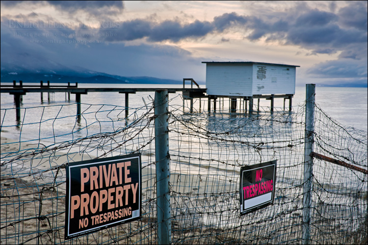 Photo: No trespassing signs and fence along the shore of Lake Tahoe, South Lake Tahoe, California Image: No trespassing signs and fence along the shore of Lake Tahoe, South Lake Tahoe, California