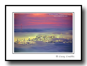 City skyline and lights of San Francisco in fog at sunset, California