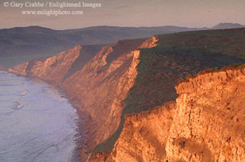 Sunrise light on the coastal cliffs above Drakes Beach, Point Reyes National Seashore, Marin County, California