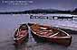 Evening light over wooden boats at Ambelside, Lake Windemere, Lakes District National Park, Cumbria, England
