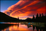 Picture: Alpenglow on lenticular cloud at sunset over alpine tarn at Tioga Pass, Yosemite National Park, California