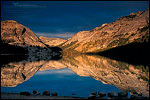 Picture: Sunset light through storm clouds on peaks above Tenaya Lake, Yosemite National Park, California