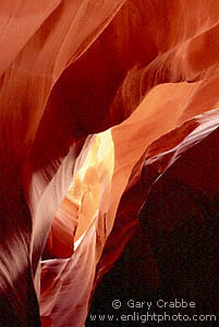 Sunlight through sandstone slot canyon, near Page, Arizona