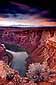 Sunset light on storm clouds over the Colorado River canyon, near Page, Arizona