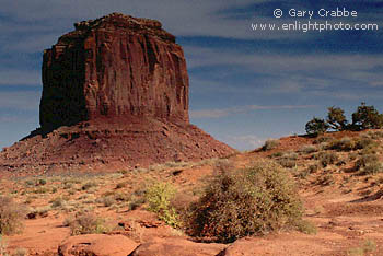 Merrick Butte rising over desert floor, Monument Valley, Arizona