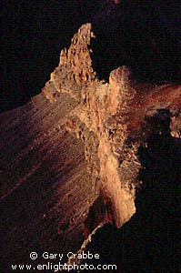 Sunset light on rock formation looking down into the Grand Canyon, Grand Canyon National Park, Arizona