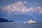 BC Ferry crossing the Queen Charlotte Channel beneath cloud covered coastal mountains, near Vancouver, British Columbia, Canada