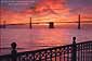 Sunrise over the San Francisco - Oakland Bay Bridge from, the Embarcadero, San Francisco, California