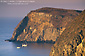 Photo: Sailboat anchored below sheer cliffs of Anacapa Island, Channel Islands National Park, Southern California Coast