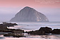 Twilight over Morro Rock and ocean, from Morro Strand State Beach, California