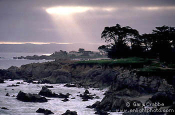 Sunbeams through coastal fog over Monterey, near Carmel, Monterey Peninsula, California