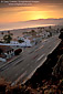 Sunset over the Pacific Coast Highway and sand beach, Santa Monica, Los Angeles County Coast, Southern California