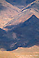 Shadow and sunlight on barren desert mountain, Death Valley National Park, California