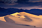 Sunset after a storm on desert sand dunes near Stovepipe Wells, Death Valley National Park, California