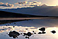 Sunset over the Panamint mountains reflected in water, Badwater, Death Valley National Park, California