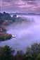Lone fisherman on dock at dawn, Lafayette Resevoir, Lafayette, Contra Costa County, California