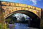 Sunset light on old stone bridge over the Napa River, near St. Helena, Napa Valley Wine Region, California