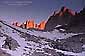 Alpenglow at sunrise on rock spires near Mount Whitney, Eastern Sierra, California