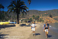 Picture: Couple backpacking returns to sandy beach at Two Harbors, Catalina Island, California