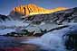 First light at sunrise on North Peak over a cascading alpine stream, Hoover Wilderness, near Yosemite National Park, California