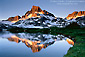 Alpenglow at sunrise on Banner Peak reflected in 1000 Island Lake, Ansel Adams Wilderness, Eastern Sierra, California
