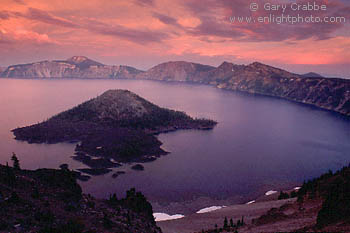 Red sky and storm clouds at sunset over Wizaard Island and Crater Lake, Crater Lake National Park, Oregon