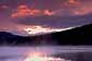 Red clouds at sunrise in stormy sky over Trillium Lake, Mount Hood National Recreation Area, Oregon
