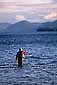 Fly fisherman in waders fishing in Lake George, Adirondack Mountains, New York
