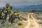 Picture: Rough empty straight dirt road next to Joshua trees through the desert, Kern County, California
