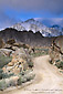Photo: Twisting dirt road below mountain peak, Eastern Sierra, California