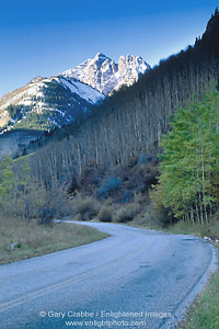 Photo: Snow covered mountain peak over twisting mountain road and aspen trees,  near Aspen, Rocky Mountains, Colorado
