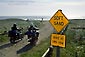 Picture: Soft Sand caution sign next to motorcycles driving onto beach, near Orick, Humboldt County, California