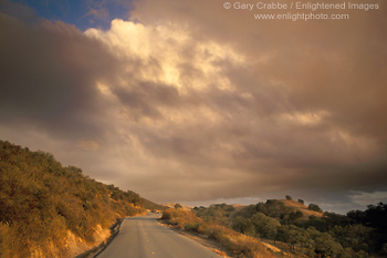 Image: Storm clouds at sunset over empty two lane mountain road, Mount Diablo State Park, California