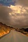 Picture: Storm clouds over empty country road, Mount Diablo State Park, California