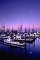 Moonset at dawn over commercial fishing boats in the Crescent City Harbor, Del Norte County, California