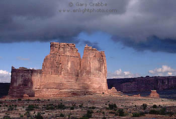 Storm clouds and red rock cliffs near Park Avenue, Arches National Park, Utah
