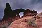 Evening storm clouds over Turret Arch, Arches National Park, Utah