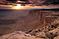 Picture: Stormy sunset over dirt road from atop a high desert mesa, Muley Point Overlook, Glen Canyon NRA, Utah