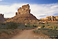 Picture: Dirt road below red rock butte, Valley of the Gods, Utah