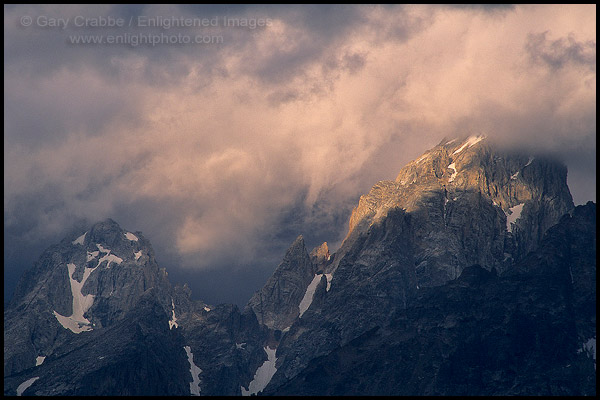 Photo: Sunlight on storm clouds near the summit of the Grand Tetons, Grand Teton Nat'l. Pk., WYOMING