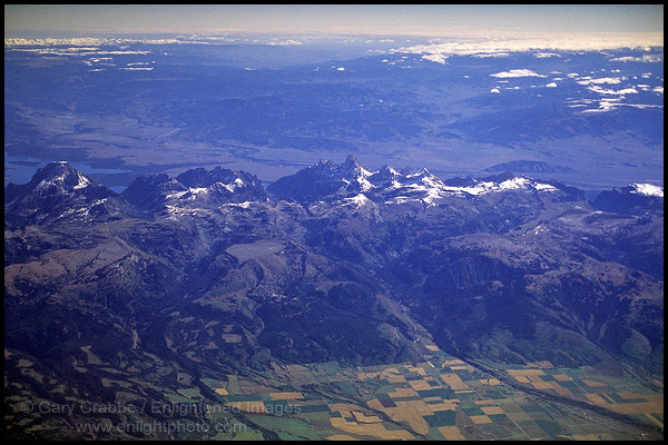 Aerial over uplifted Tetons Mountain range and Driggs Valley
